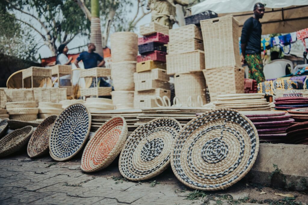 Colorful woven baskets displayed at an outdoor market in Abuja, Nigeria.